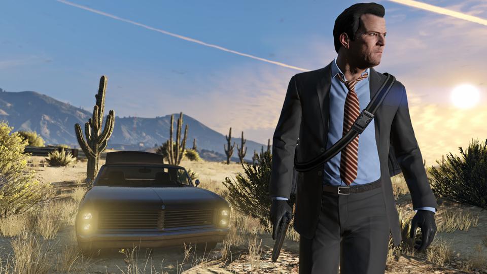GTA 5 protgaonist Michael walking in desert with car behind him.