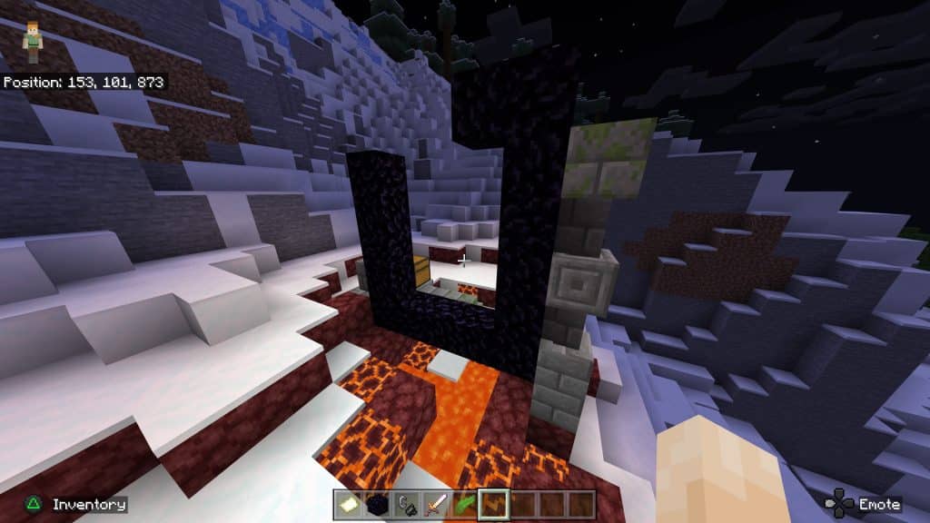A ruined Nether portal on a mountain