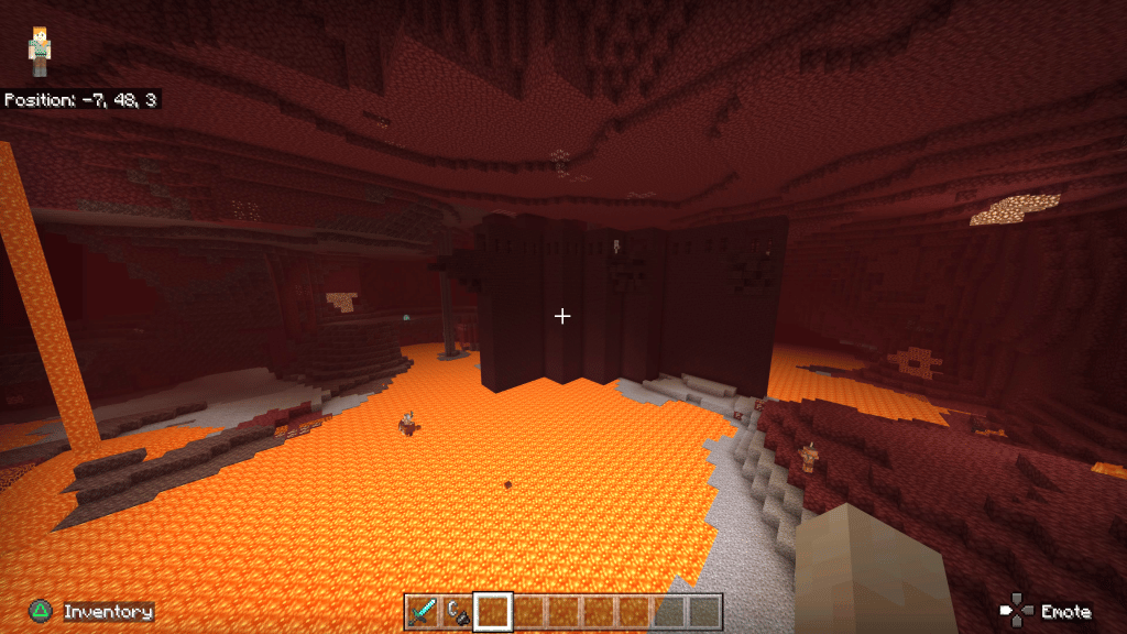 A large Nether fortress next to a lava pit