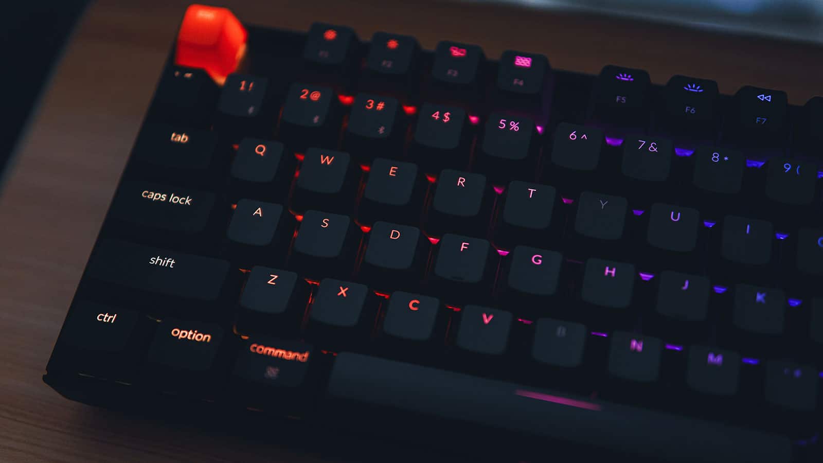RGB gaming keyboard on wooden desk