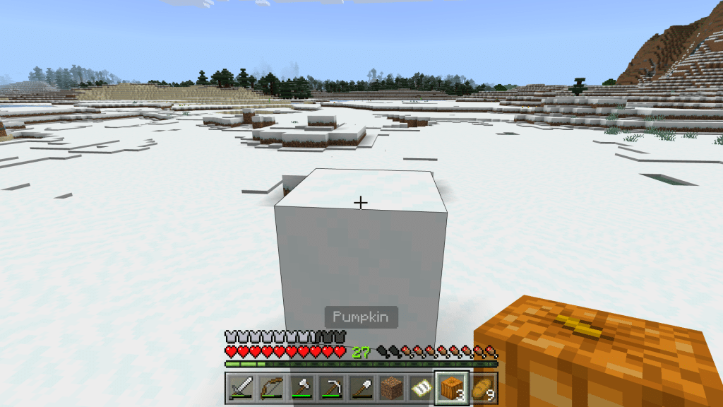 Two blocks of snow and the pumpkin goes on the top to make a snowman in Minecraft