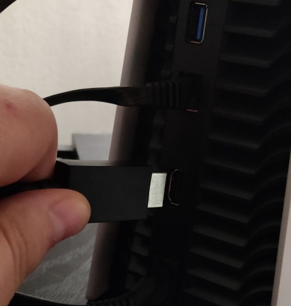 HDMI cable being plugged into PS5
